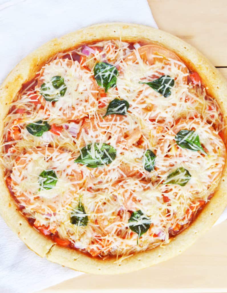 margherita pizza with tomatoes, basil and cheese