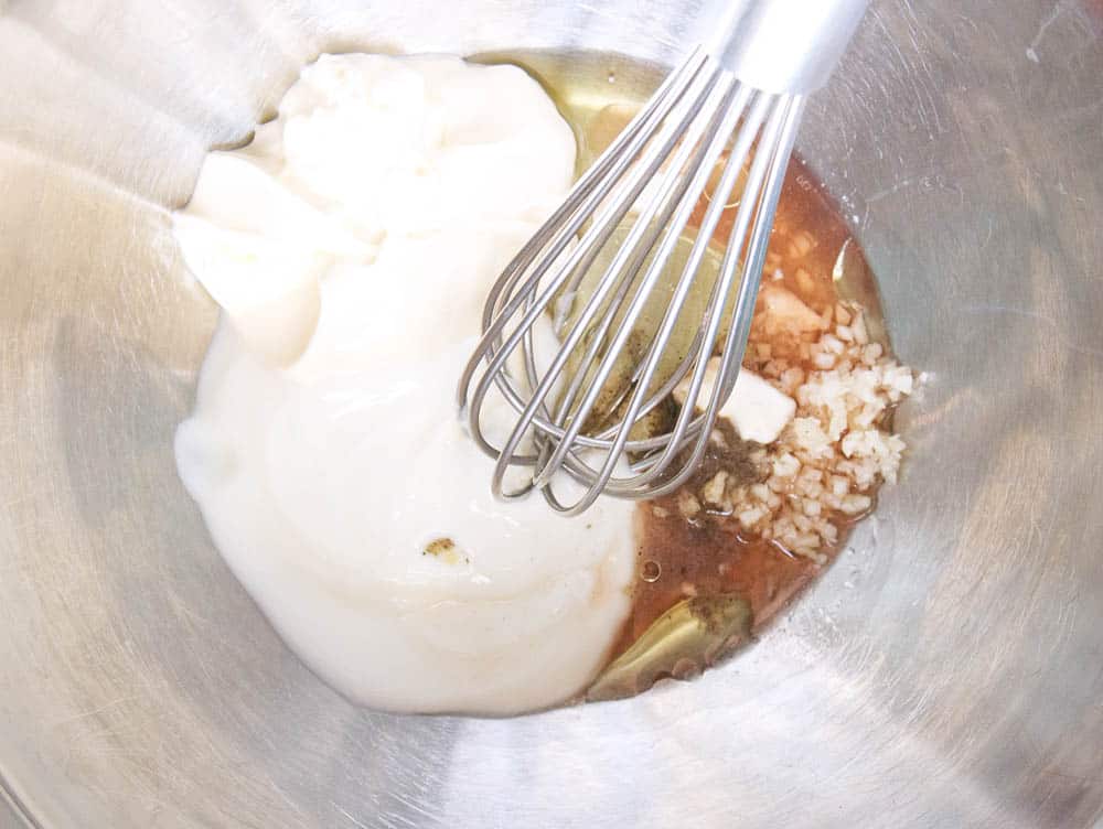 Ingredients for dressing being mixed together