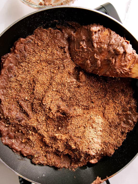 beans and taco seasoning in a pan