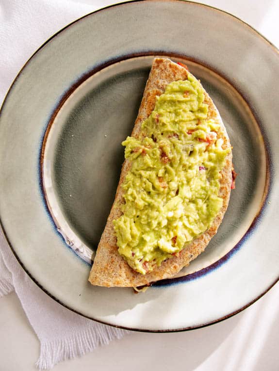 black bean quesadillas topped with guacamole
