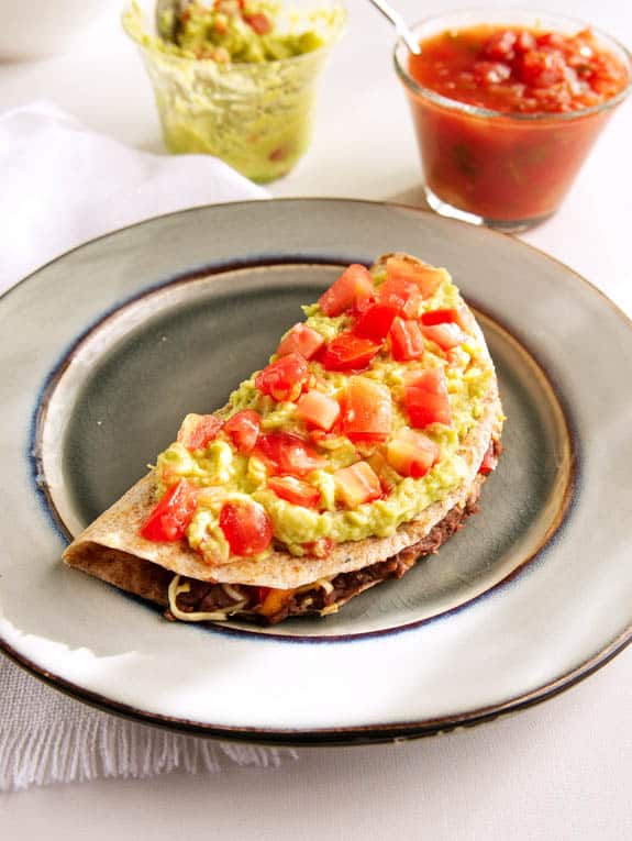 black bean healthy quesadillas topped with salsa