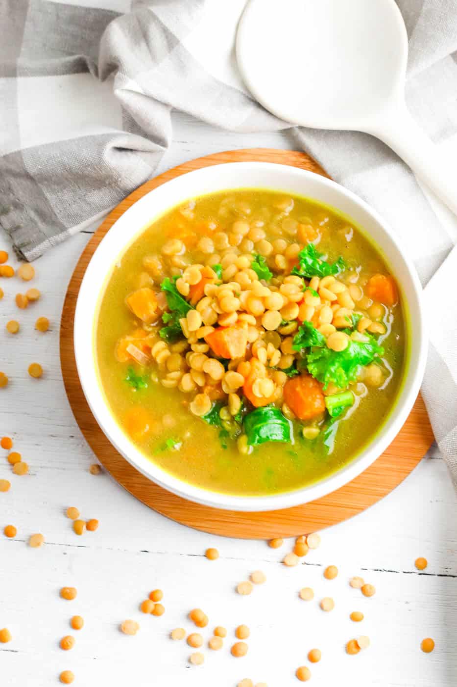 sweet potato dahl with kale served in a white bowl