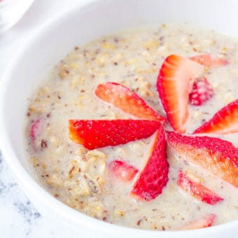 strawberries and cream oatmeal, strawberry oatmeal in a white bowl