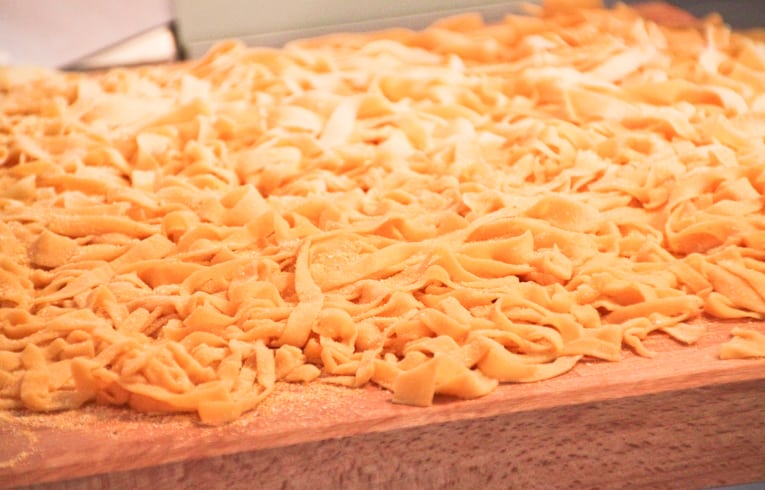 uncooked Homemade Tagliatelle on a chopping board