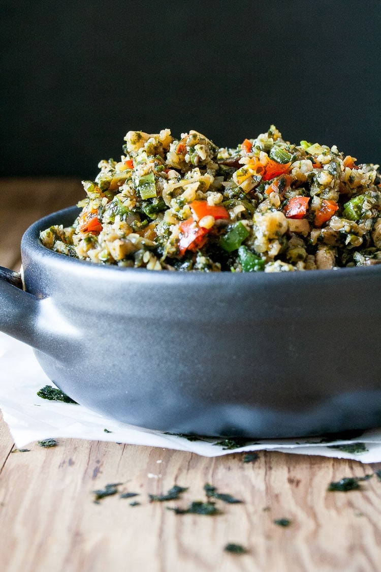 A close up of a blue bowl filled with Stir Fry Cauliflower Rice and veggies A close up of a blue bowl filled with Stir Fry Cauliflower Rice and veggies
