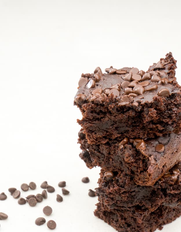 delicious, flourless, gluten free brownies against a white background