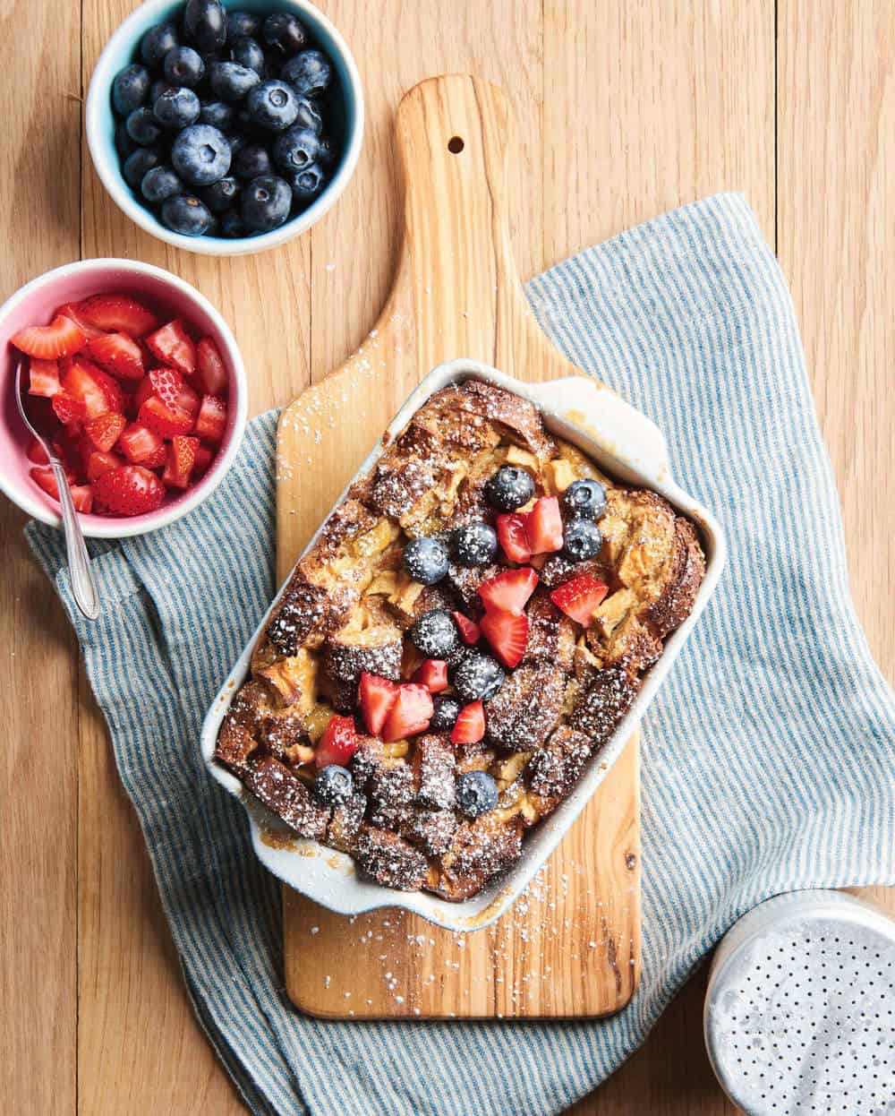french toast bread pudding served with fresh berries, top view