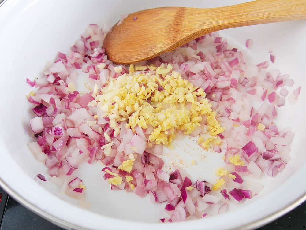 garlic/ginger added to onions in the pan