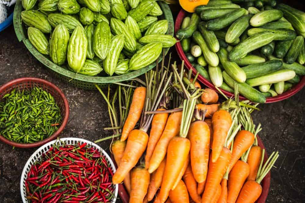 a mix of squashes, carrots, and chiles produced from a biodynamic farm