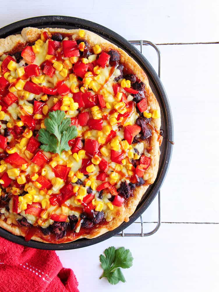 Red Pepper pizza drizzled with bbq sauce - closeup of bbq flatbread