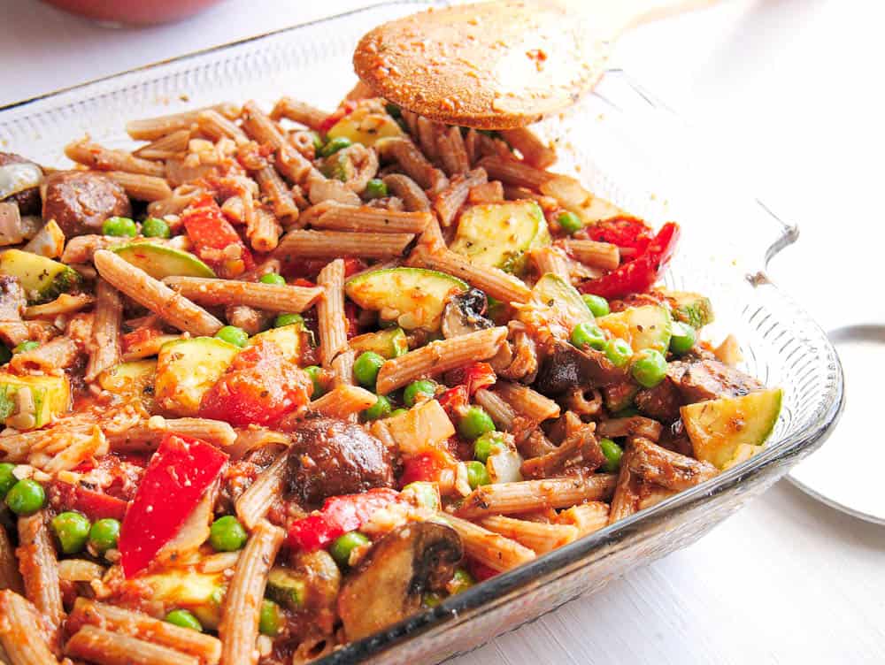 Ingredients for the baked penne pasta - pasta, veggies, cheese, sauce - mixed together