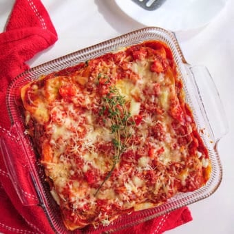 A healthy vegetarian lasagna garnished with fresh thyme