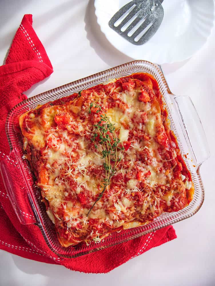A Healthy Vegetable Lasagna garnished with fresh thyme
