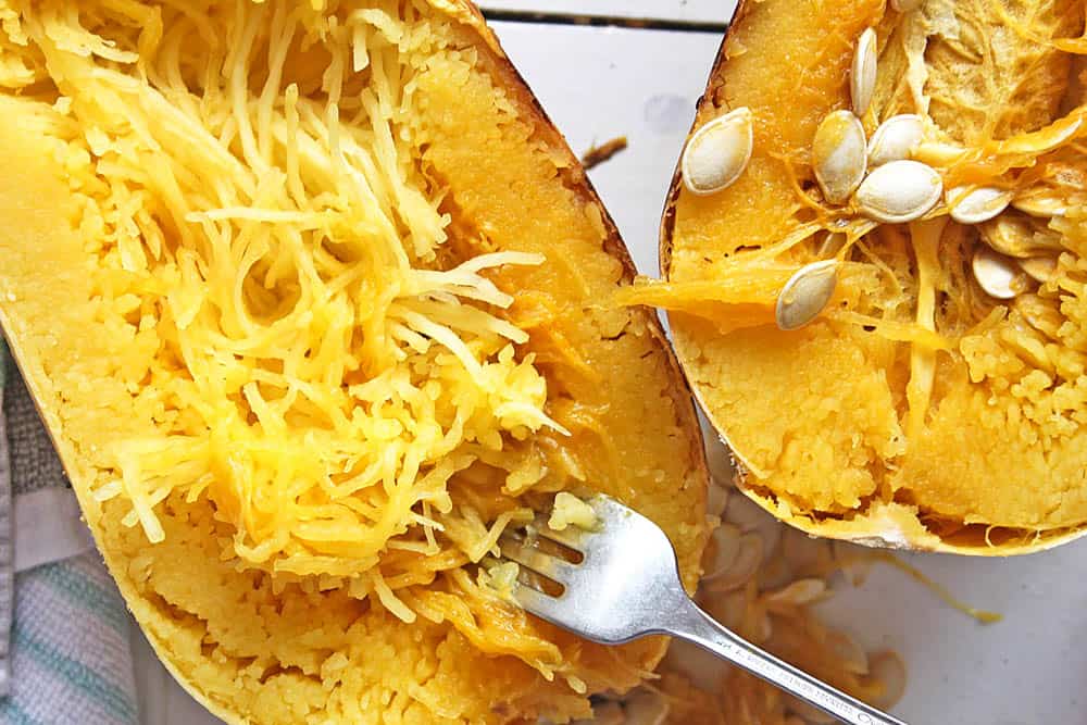 Cooked spaghetti squash being shredded