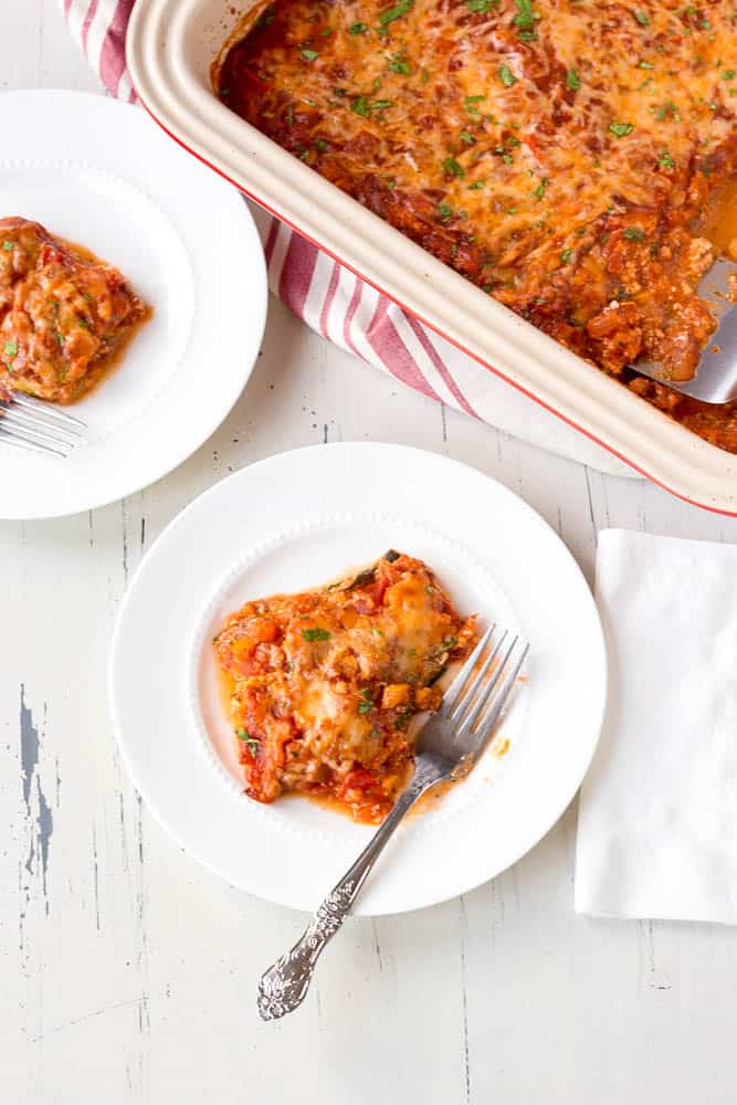 Low carb vegetarian zucchini lasagna serve on white plates with forks