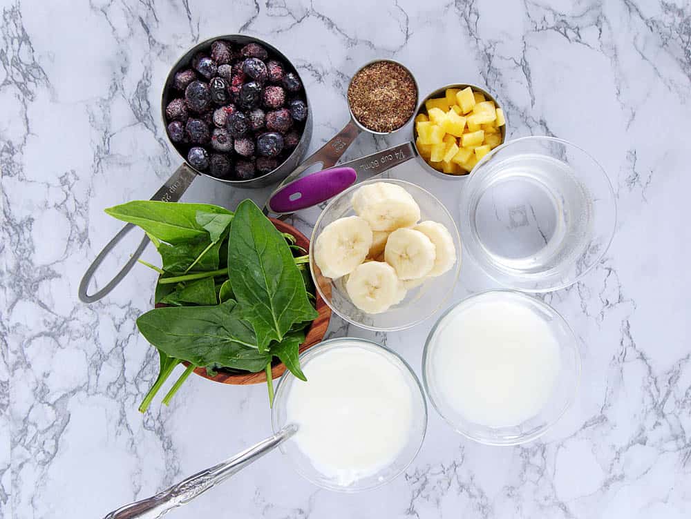 Ingredients to make a blueberry banana smoothie