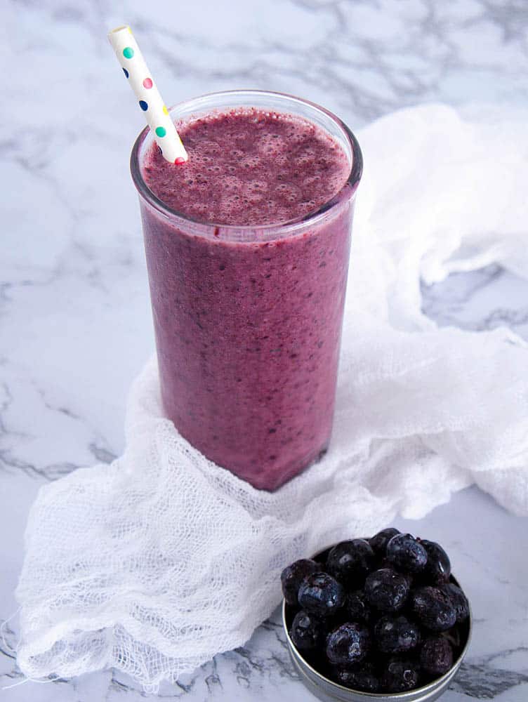 A blueberry banana smoothie in a glass