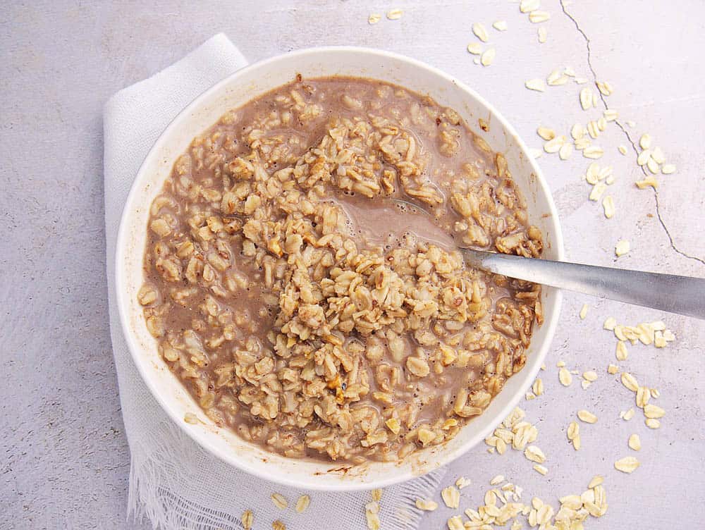 Top shot of dark chocolate oatmeal, in a white bowl