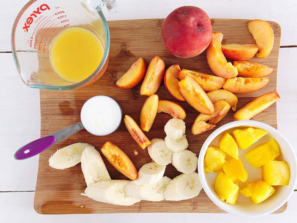 Ingredients to make a banana peach smoothie