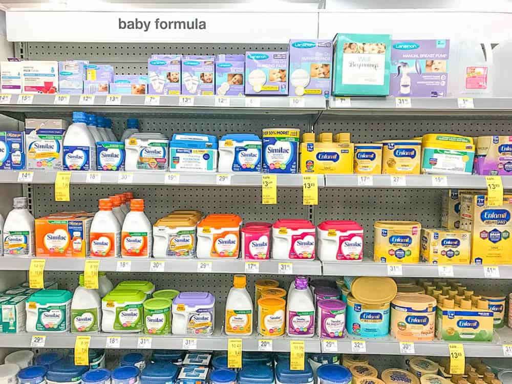 photo of common US baby formula brands (similac, enfamil, etc) on drugstore shelf - best baby formulas for constipation