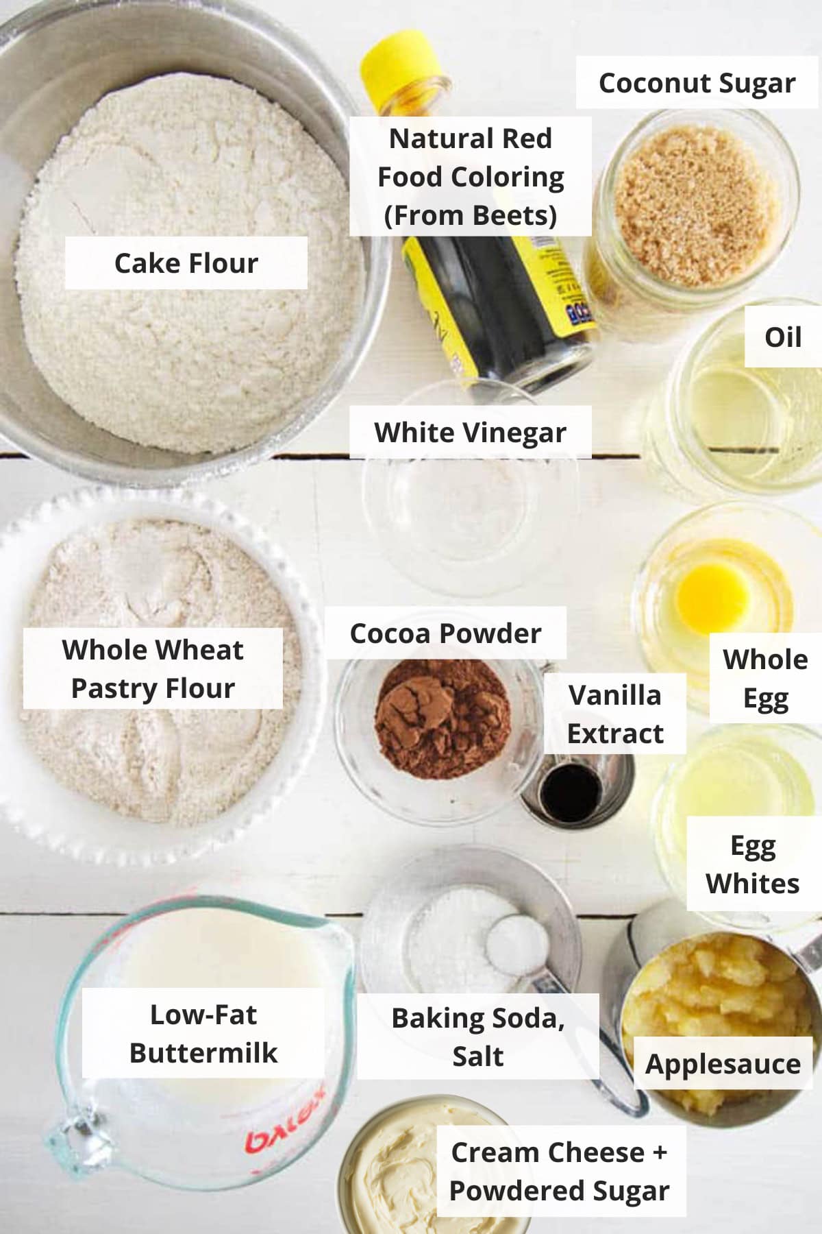 Ingredients for healthy red velvet cupcakes on a marble countertop.
