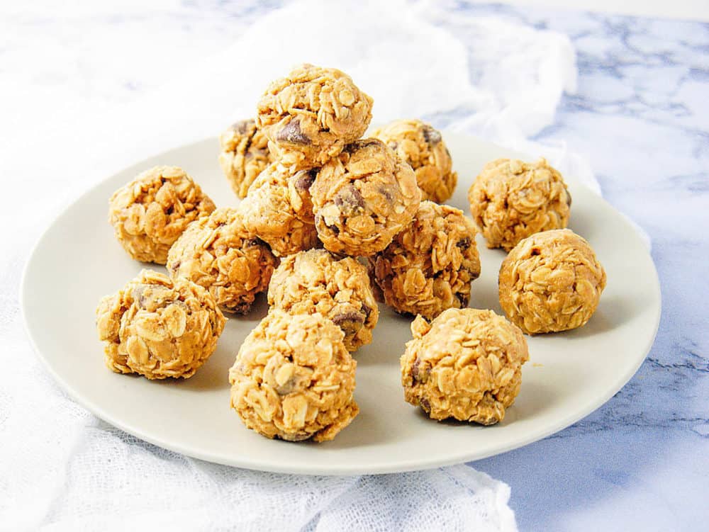 No Bake Peanut Butter Balls, stacked on a white platter
