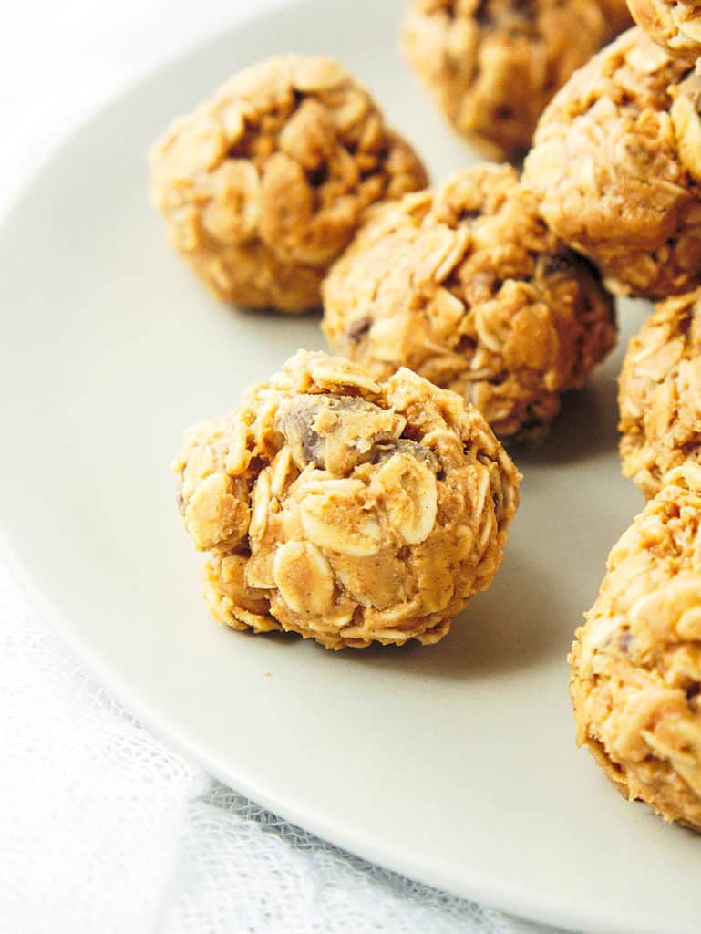close up of No Bake Peanut Butter Balls on a white platter