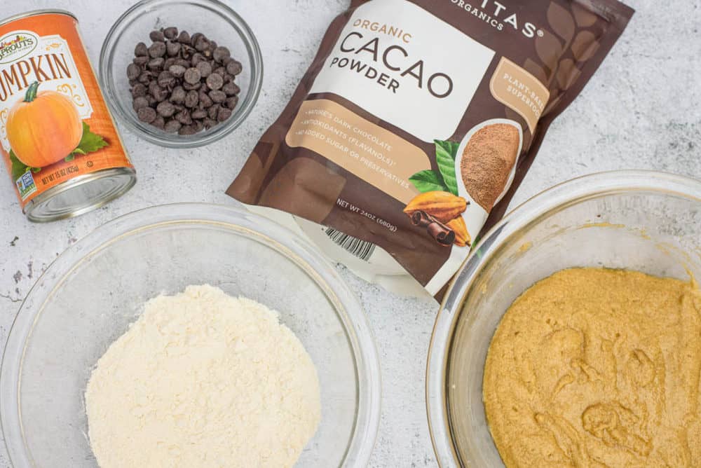ingredients for layered pumpkin brownies - cacao powder, flour, pumpkin, chocolate chips, etc.