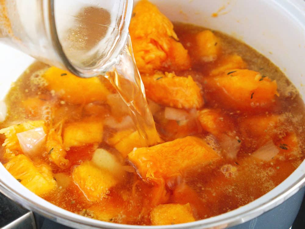 butternut squash and stock added to garlic/onion mixture