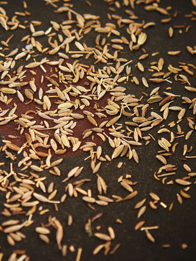 cumin seeds toasting in a skillet