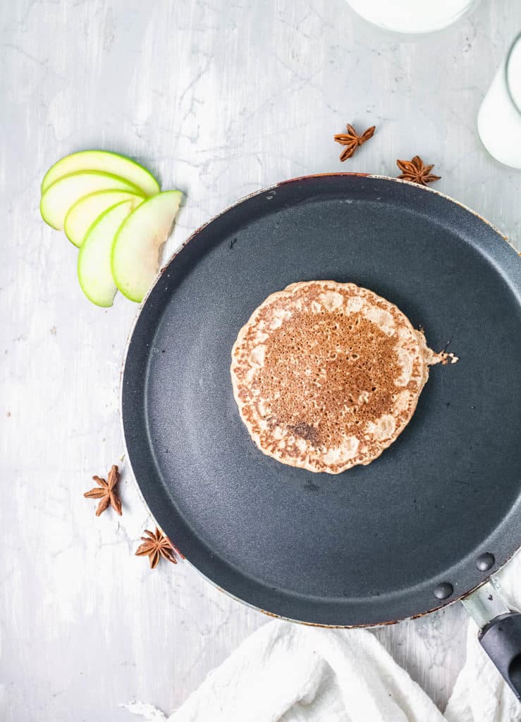 pancakes being cooked on a skillet