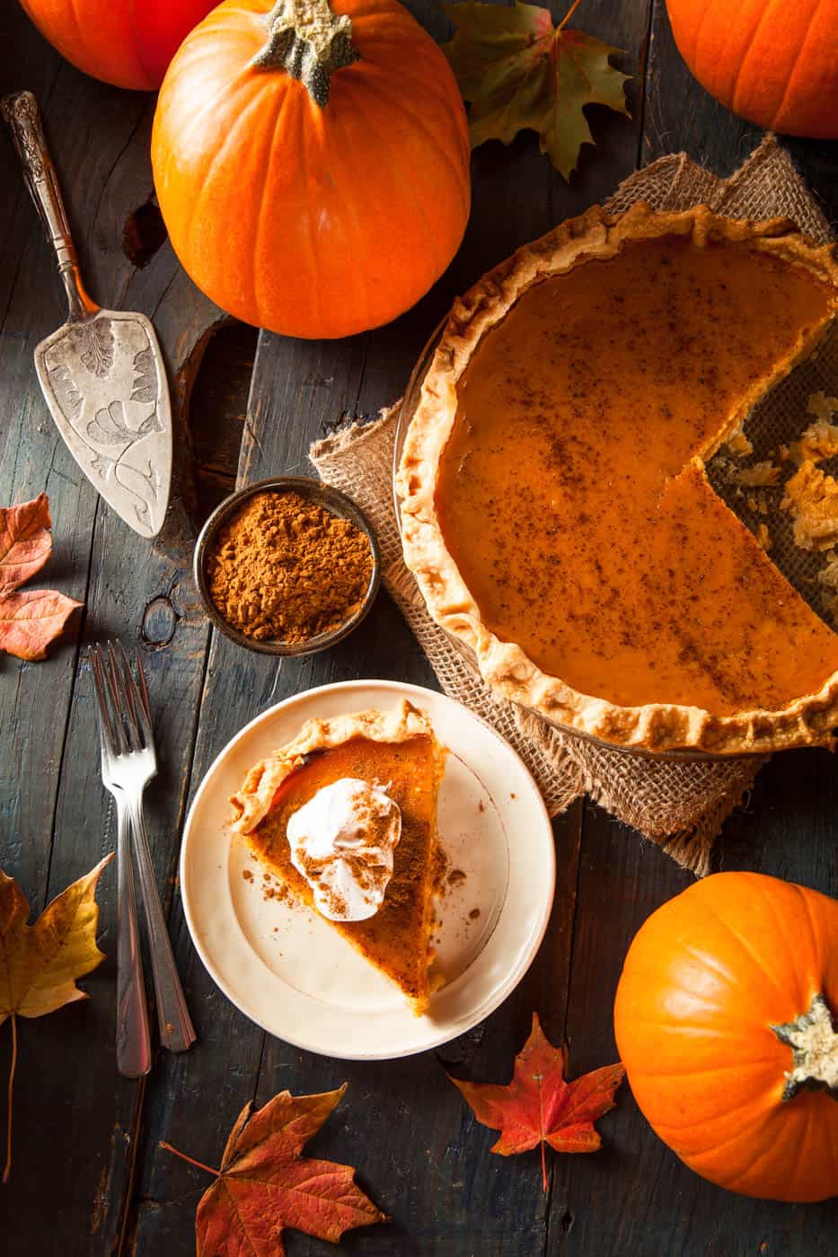 healthy pumpkin pie, low calorie, gluten free option - slice of pumpkin pie cut and served on a white plate, top view