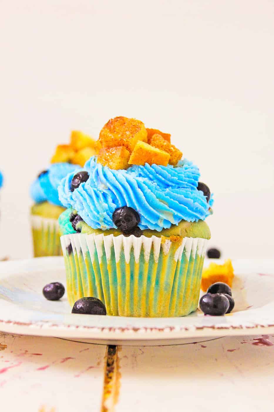Blueberry Lemonade Cupcakes With Lemon Cream Cheese Frosting with french toast cubes on top