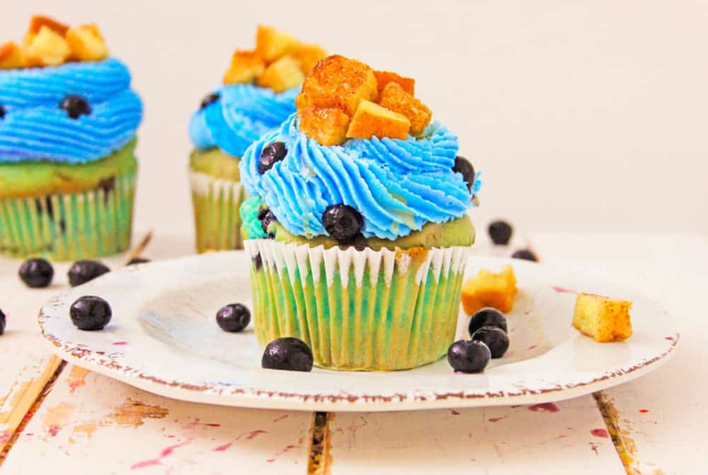Blueberry Lemonade Cupcakes With Lemon Cream Cheese Frosting with french toast cubes on top