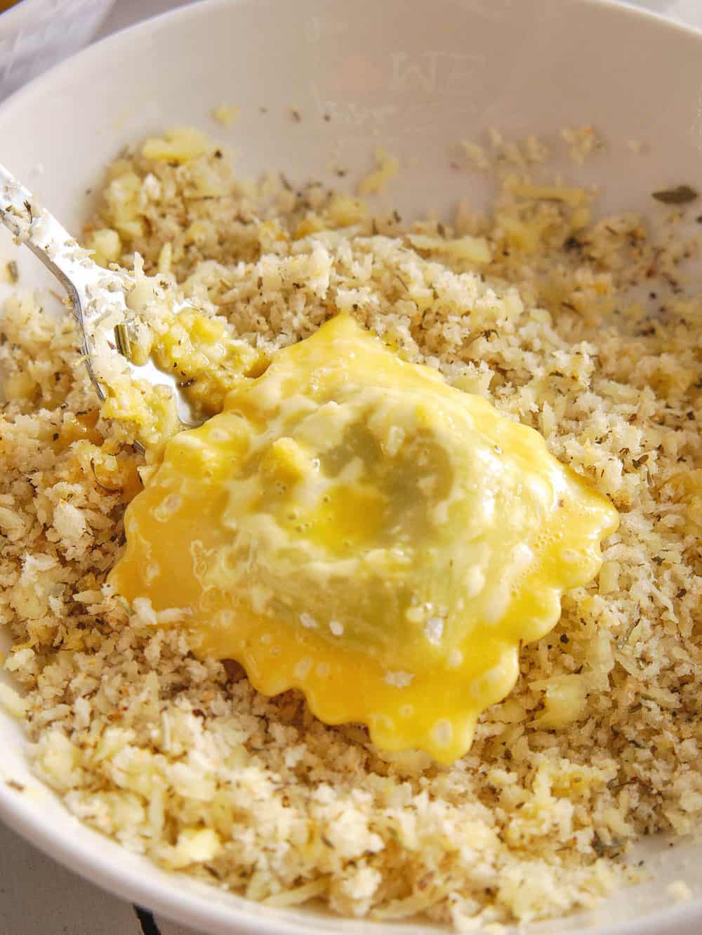 Glass jar on a blue striped towel filled with roasted crispy chickpeas.