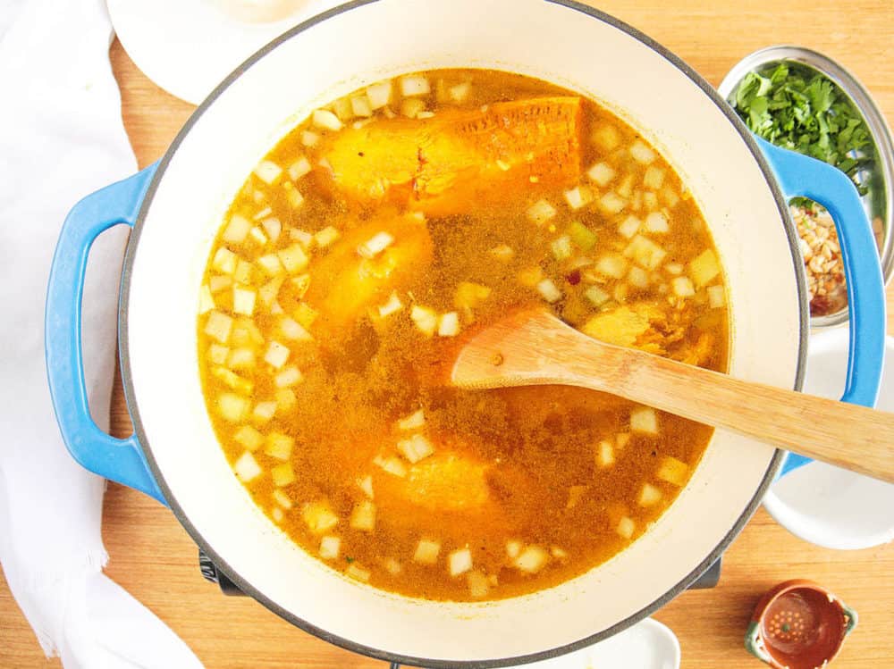 soup simmering on stovetop in large pot