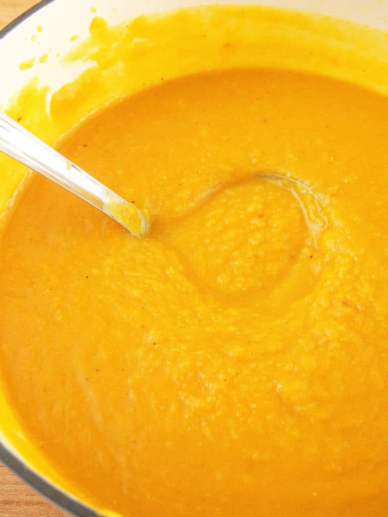 blended sweet potato soup in a pot, ready to serve