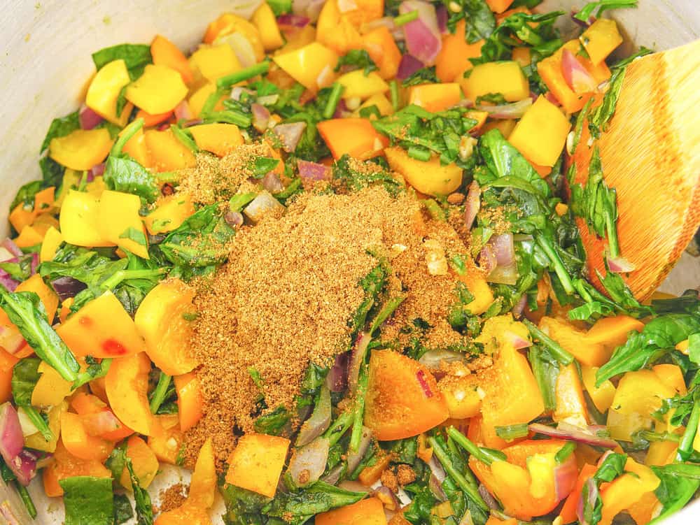 vegetables and spices added to pot
