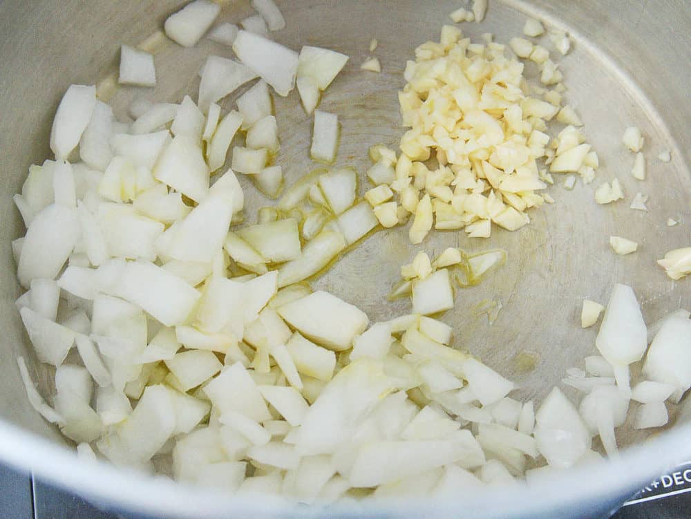 onions and garlic sauteeing in a pot