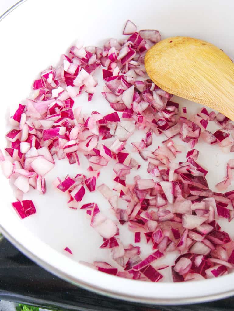 onions sauteeing in a pot