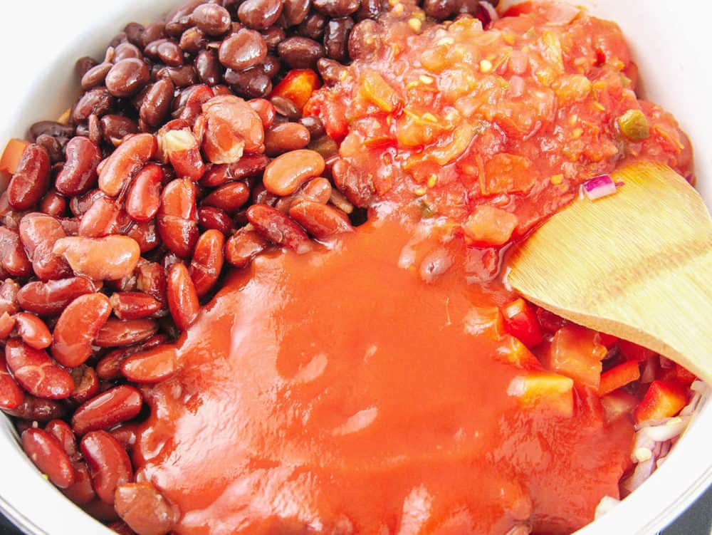 beans and salsa added to the pot
