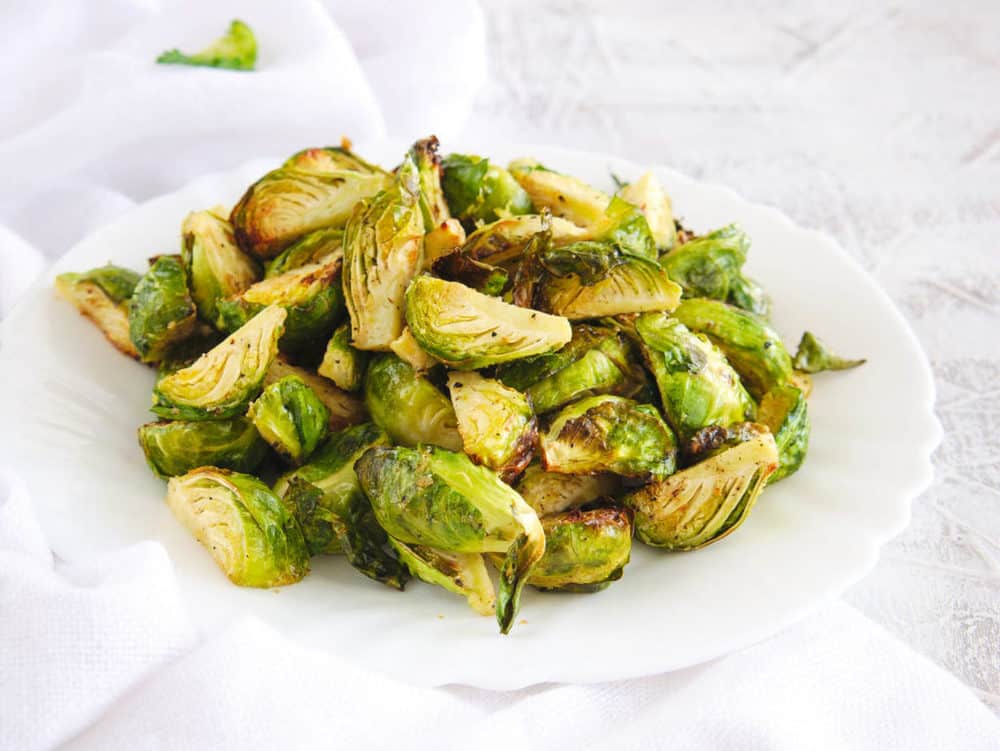 air fryer brussel sprouts served on a white plate