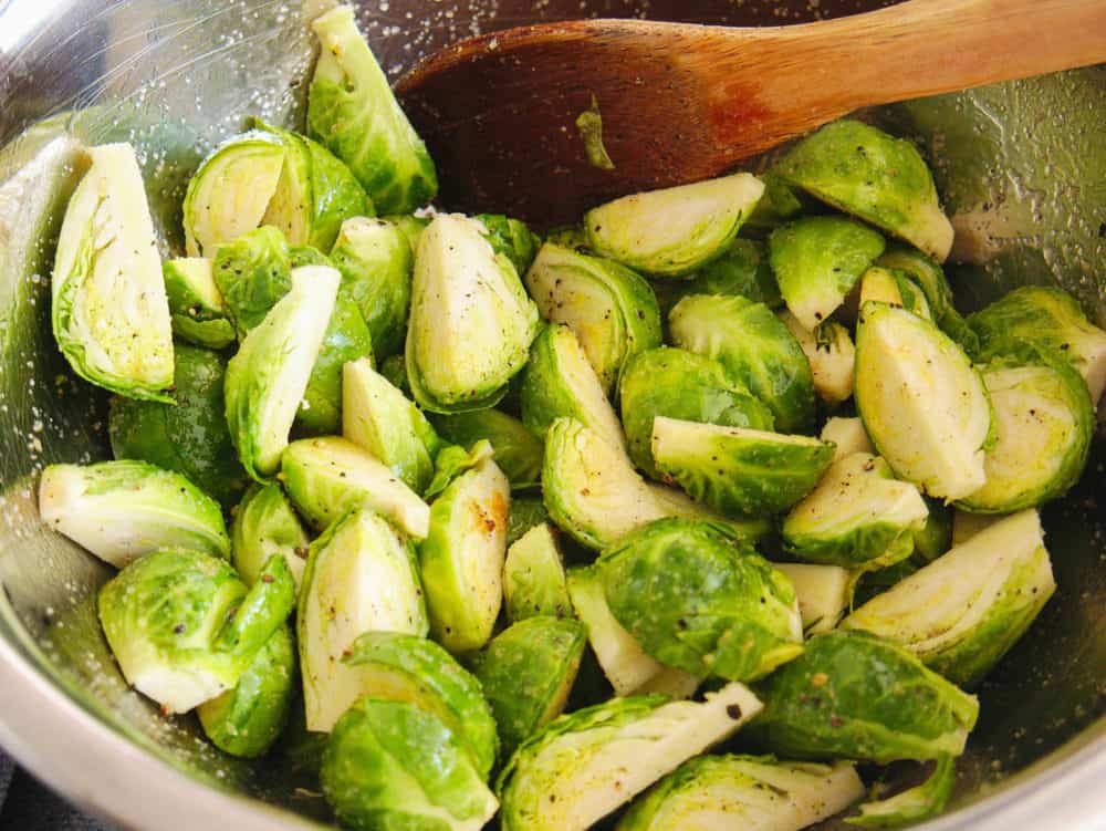 brussel sprouts in a silver mixing bowl