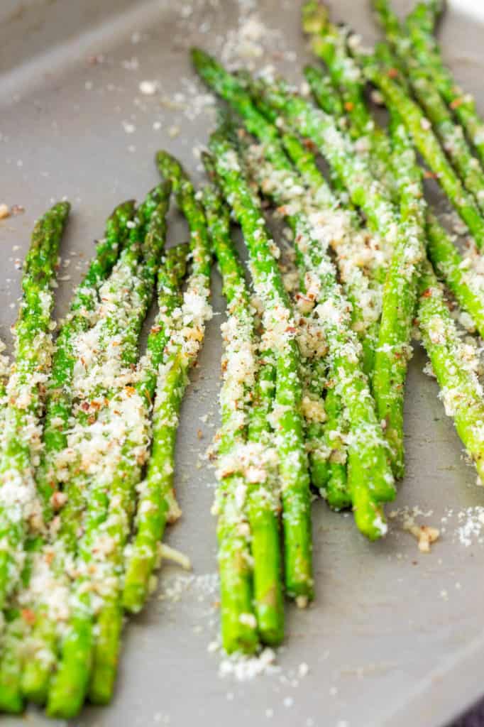asparagus with pecorino, on a baking sheet