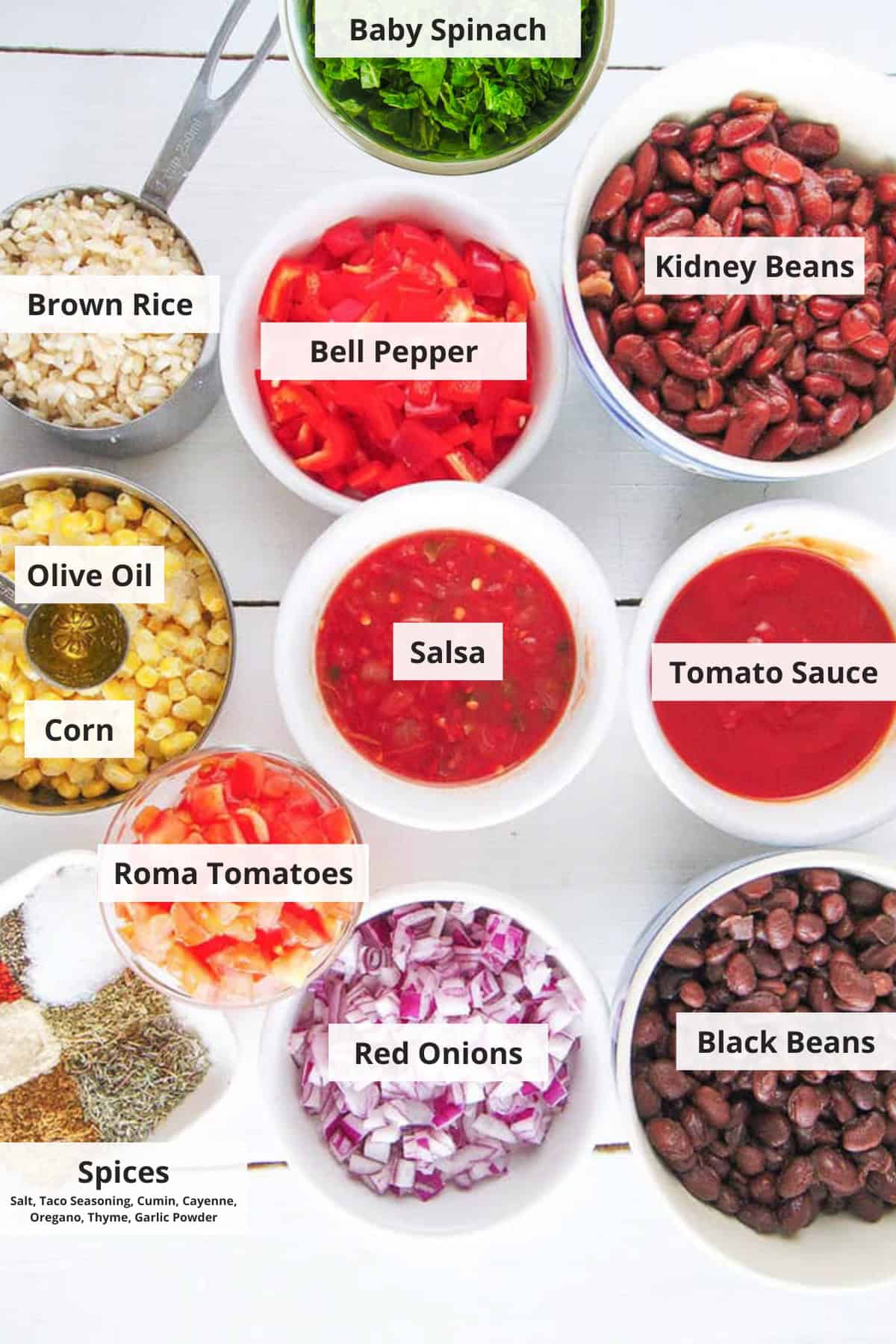 Ingredients for rice and bean stew recipe on a white countertop.