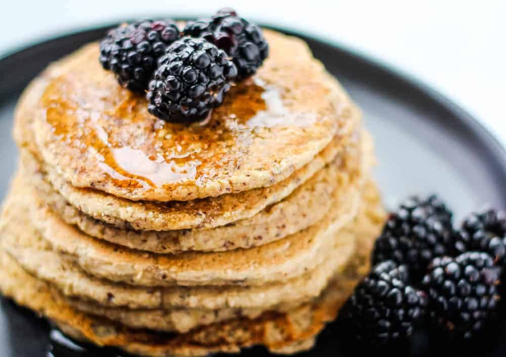pancakes topped with maple syrup