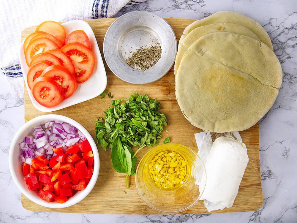 ingredients for healthy pita pizzas with goat cheese