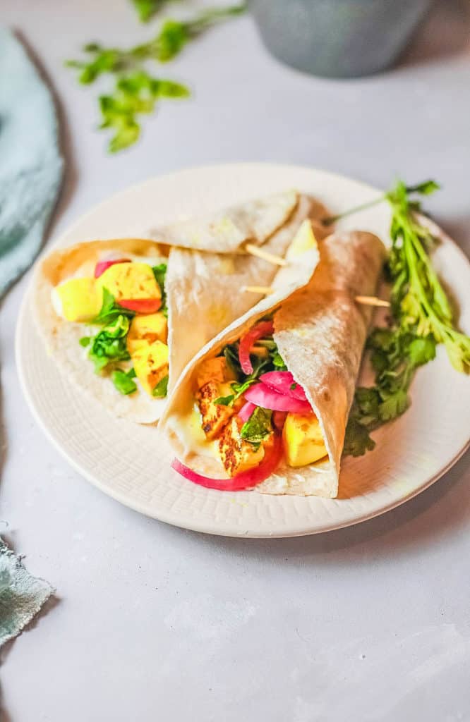 veggie shawarma with marinated tofu, served on a tan plate