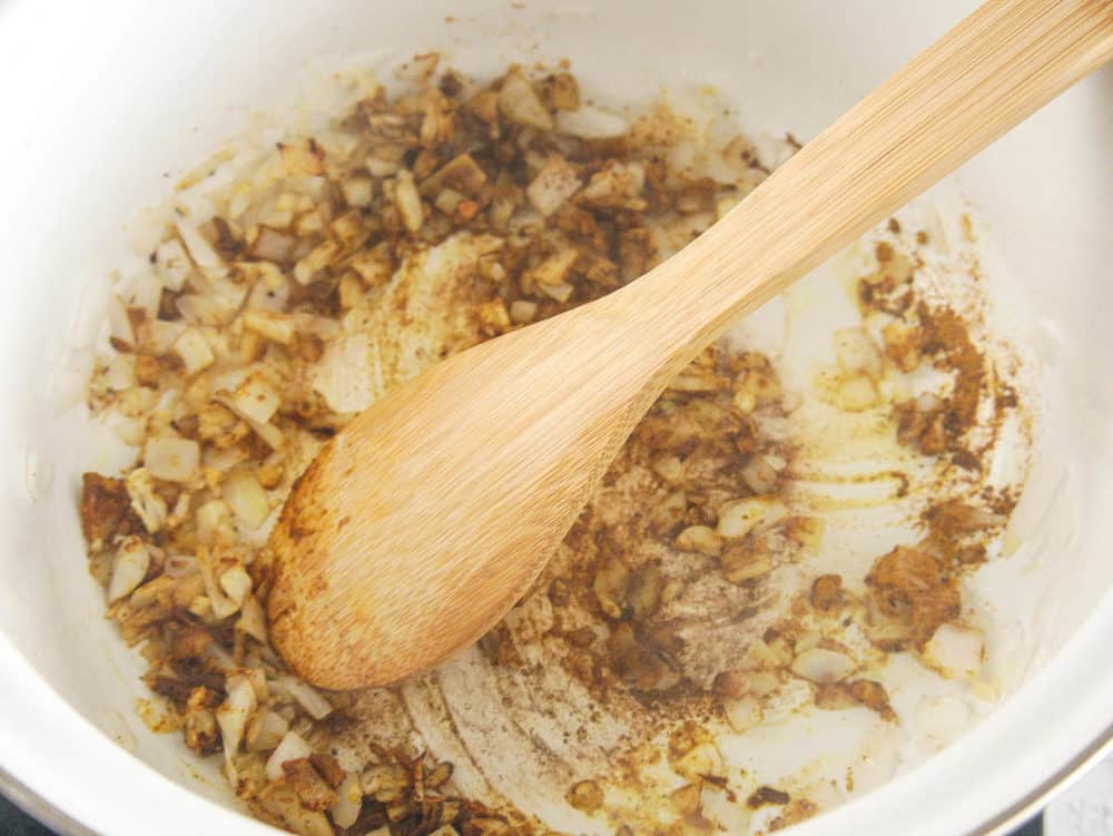 onions and spices sauteeing in a pot