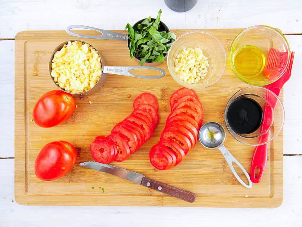ingredients for margherita flatbread - tomatoes, basil, garlic, balsamic